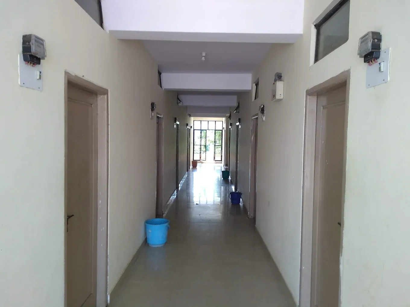 Clean PG corridor with room doors